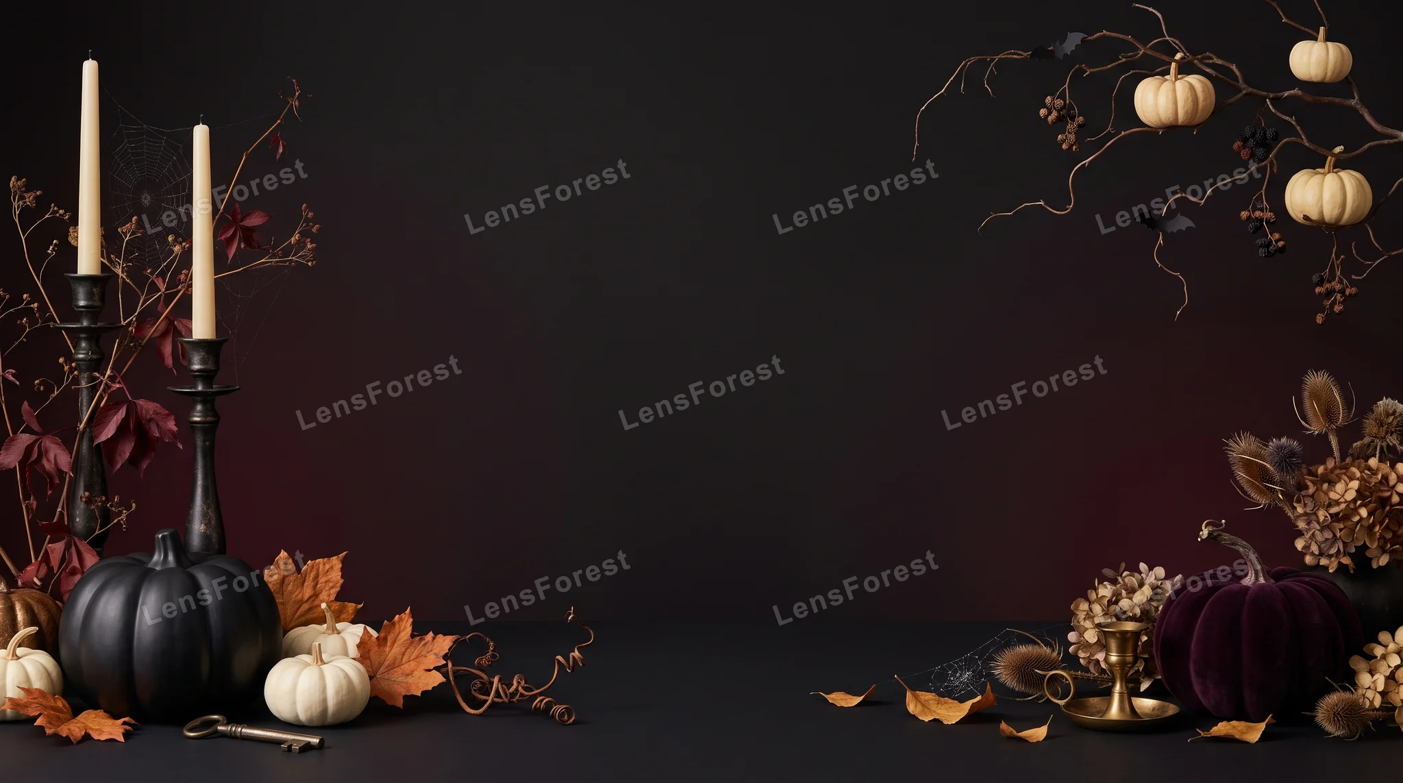 Halloween still life with black and white pumpkins, taper candles, and autumn foliage on a dark background.