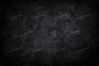 A dark grunge texture overlay with scratches, dust and worn marks on a black background, full frame
