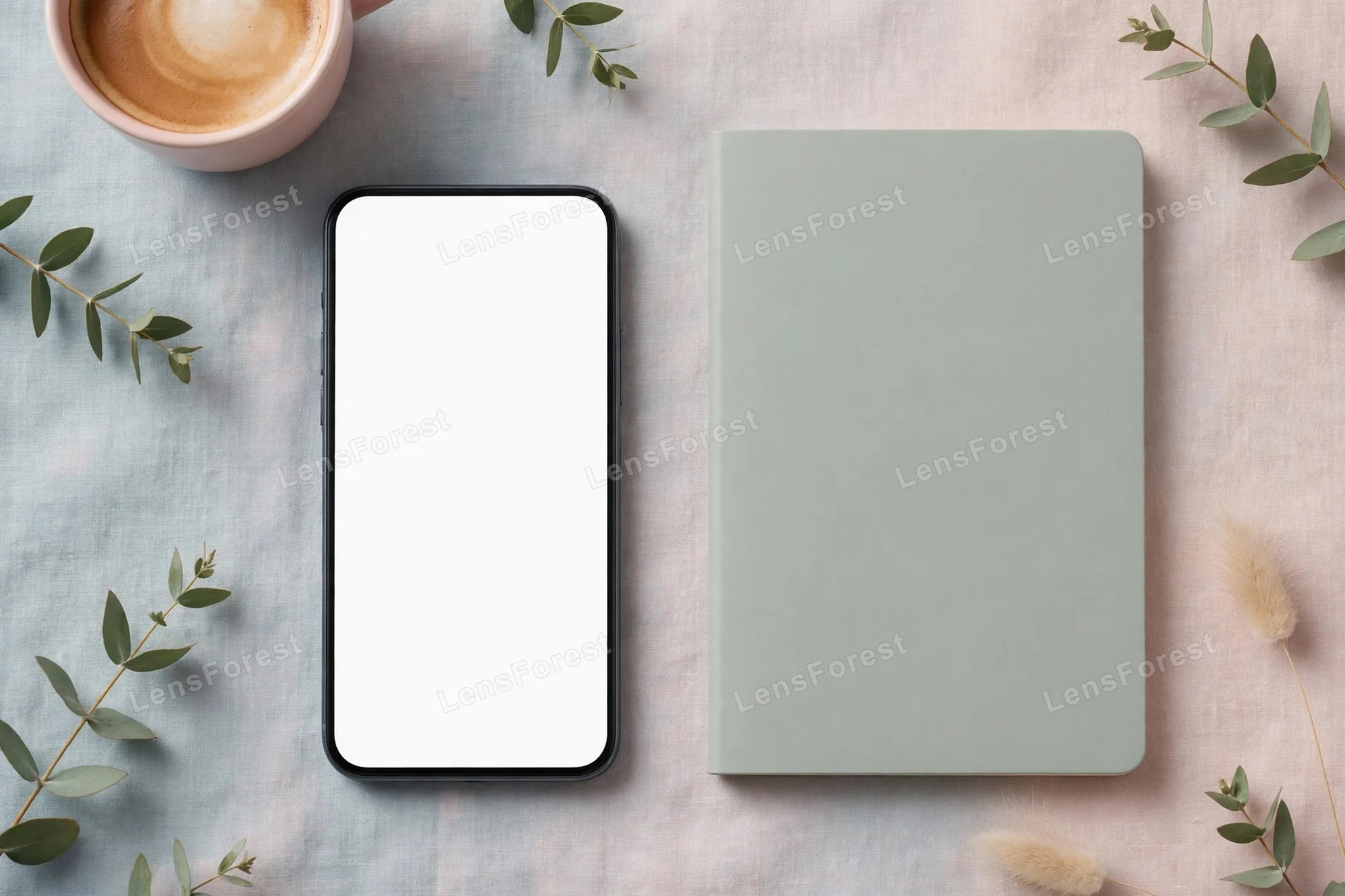 A smartphone with a blank screen on a pastel desk flat lay with a coffee cup, notebook and soft daylight, a clean mockup scene