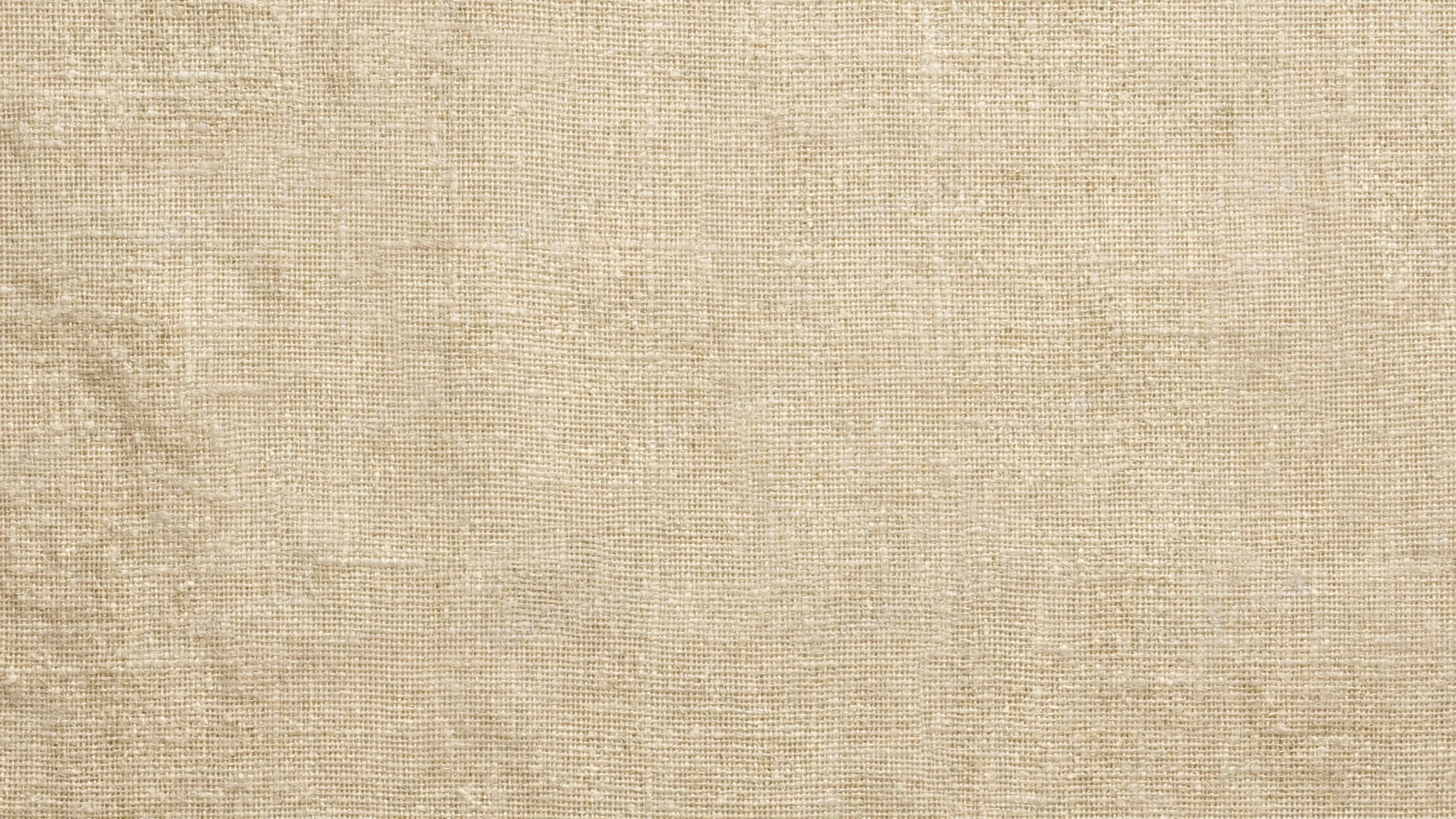 A full-frame cream linen fabric texture with natural woven detail and a soft neutral tone