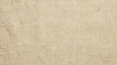 A full-frame cream linen fabric texture with natural woven detail and a soft neutral tone